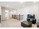 Upstairs hallway features a bonus area with entertainment center and view of bath at 306 Todder Trl, Goose Creek, SC 29445