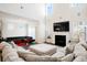Bright living room featuring a fireplace, sectional sofa, and clerestory windows at 306 Todder Trl, Goose Creek, SC 29445