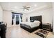 Main bedroom featuring a tray ceiling, ceiling fan, and gray upholstered bed at 306 Todder Trl, Goose Creek, SC 29445