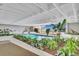 Beautiful indoor pool with ample seating, surrounded by vibrant plants, creating a serene and tropical atmosphere at 330 Concord St # Th 9, Charleston, SC 29401