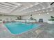 Inviting indoor pool area features ample natural light and lush greenery creating a tranquil and relaxing atmosphere at 330 Concord St # Th 9, Charleston, SC 29401
