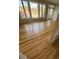 Open living room with freshly finished floors, large windows, and neutral paint at 330 Concord St # Th 9, Charleston, SC 29401