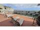 Inviting patio with lounge chairs, perfect for relaxing with waterfront views and enjoying the coastal breeze at 330 Concord St # Th 9, Charleston, SC 29401