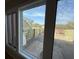 Window view of private back patio with newly installed wooden fence and covered seating area at 330 Concord St # Th 9, Charleston, SC 29401