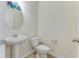Powder room with modern fixtures, pedestal sink, and decorative mirror at 346 Iveson Rd, Summerville, SC 29486