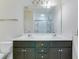 Bathroom vanity with dual sinks, a large mirror and views into an enclosed shower at 346 Iveson Rd, Summerville, SC 29486