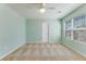 Bright bedroom with light-colored walls and carpet, featuring a ceiling fan and natural light from the window at 346 Iveson Rd, Summerville, SC 29486