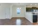 Bright dining area featuring stylish lighting and seamless flow to the modern kitchen at 346 Iveson Rd, Summerville, SC 29486
