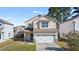 Charming two-story home with a two-car garage and well-maintained lawn at 346 Iveson Rd, Summerville, SC 29486