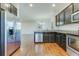 Modern kitchen with stainless steel appliances, granite countertops, and hardwood floors at 346 Iveson Rd, Summerville, SC 29486