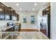 Open kitchen with granite countertops, stainless steel appliances, and dark cabinetry at 346 Iveson Rd, Summerville, SC 29486