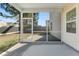 Enclosed porch with a view of the backyard and ample space for outdoor seating and relaxation at 346 Iveson Rd, Summerville, SC 29486