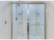 Enclosed shower with glass doors and shelving for toiletries at 346 Iveson Rd, Summerville, SC 29486