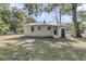 Spacious backyard surrounded by mature trees, offering a private and tranquil outdoor space at 3484 Johan Blvd, Johns Island, SC 29455
