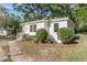 Charming cottage-style home with fresh white exterior and landscaping at 3484 Johan Blvd, Johns Island, SC 29455