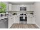Bright kitchen featuring stainless steel appliances, quartz countertops, and ample cabinet space at 3484 Johan Blvd, Johns Island, SC 29455