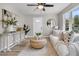 Bright living room features stylish decor, a large window, and neutral accents at 3484 Johan Blvd, Johns Island, SC 29455