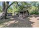 Outbuilding featuring wood construction and mature tree coverage at 3484 Johan Blvd, Johns Island, SC 29455