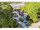 Stunning aerial view of a traditional Gathering home with lush landscaping and a long driveway leading to the street at 3600 Henrietta Hartford Rd, Mount Pleasant, SC 29466