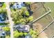 Beautiful Gathering home nestled within lush trees with access to a private dock, as seen from an aerial perspective at 3600 Henrietta Hartford Rd, Mount Pleasant, SC 29466