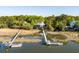 Aerial showcasing a beautiful home with a private dock, surrounded by serene marshlands and mature trees at 3600 Henrietta Hartford Rd, Mount Pleasant, SC 29466