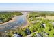 Expansive aerial view showcases waterways and the home's location near docks and the vast natural surroundings at 3600 Henrietta Hartford Rd, Mount Pleasant, SC 29466