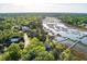 Aerial view of stunning waterfront home surrounded by lush landscaping and featuring private dock at 3600 Henrietta Hartford Rd, Mount Pleasant, SC 29466