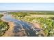Expansive aerial shot of docks and the property's location within the waterfront community and natural setting at 3600 Henrietta Hartford Rd, Mount Pleasant, SC 29466