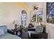 This covered balcony offers comfortable seating and a ceiling fan at 3600 Henrietta Hartford Rd, Mount Pleasant, SC 29466