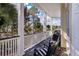 Relax on the spacious balcony featuring comfortable seating and tranquil views of the surrounding trees at 3600 Henrietta Hartford Rd, Mount Pleasant, SC 29466