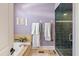 Elegant bathroom with a glass-enclosed shower, heated towel racks, and neutral tile flooring at 3600 Henrietta Hartford Rd, Mount Pleasant, SC 29466