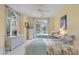 Charming bedroom featuring two twin beds, wicker furniture, and a large window allowing for ample natural light at 3600 Henrietta Hartford Rd, Mount Pleasant, SC 29466