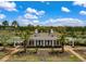 Elegant community clubhouse framed by palm trees, offering a welcoming and sophisticated gathering space at 3600 Henrietta Hartford Rd, Mount Pleasant, SC 29466