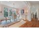 Elegant dining room featuring a glass-top table, chandelier, and natural light at 3600 Henrietta Hartford Rd, Mount Pleasant, SC 29466