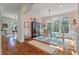 Well-lit dining room with hardwood floors, chandelier, and views to the entryway at 3600 Henrietta Hartford Rd, Mount Pleasant, SC 29466