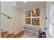 Bright entryway with a convenient storage bench, decor and easy access to both the stairs and the front door at 3600 Henrietta Hartford Rd, Mount Pleasant, SC 29466