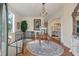 Elegant foyer with hardwood floors, chandelier, staircase and decorative rug at 3600 Henrietta Hartford Rd, Mount Pleasant, SC 29466