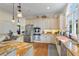Gourmet kitchen featuring custom cabinets, stainless steel appliances, and stone countertops at 3600 Henrietta Hartford Rd, Mount Pleasant, SC 29466