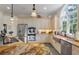 Spacious kitchen with stainless steel appliances and light tone cabinets and golden granite countertops at 3600 Henrietta Hartford Rd, Mount Pleasant, SC 29466