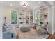 Cozy living room with built-in bookshelves, ample natural light, and hardwood flooring at 3600 Henrietta Hartford Rd, Mount Pleasant, SC 29466
