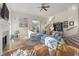 Inviting living room with hardwood floors, fireplace, and large windows for natural light at 3600 Henrietta Hartford Rd, Mount Pleasant, SC 29466