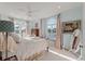 Light-filled main bedroom with large windows, plush bedding, and serene ambiance at 3600 Henrietta Hartford Rd, Mount Pleasant, SC 29466