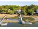 Beautiful waterfront home featuring a private dock, deck, and multiple levels of outdoor living space at 3600 Henrietta Hartford Rd, Mount Pleasant, SC 29466