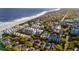 Aerial shot of colorful beachside community, pool, and ocean views from beautiful coastal neighborhood at 40 Grand Pavilion Blvd, Isle of Palms, SC 29451