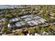 Aerial view of tennis courts surrounded by lush trees and residential homes at 40 Grand Pavilion Blvd, Isle of Palms, SC 29451