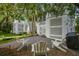 Charming backyard with comfortable seating, lush greenery, and a relaxing ambiance at 40 Grand Pavilion Blvd, Isle of Palms, SC 29451