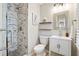 Well-lit bathroom with a mosaic tiled shower and modern vanity with storage at 40 Grand Pavilion Blvd, Isle of Palms, SC 29451