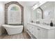 Elegant bathroom with soaking tub, and a large window at 40 Grand Pavilion Blvd, Isle of Palms, SC 29451