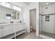 Light and airy bathroom with double vanity, tiled shower, and modern fixtures at 40 Grand Pavilion Blvd, Isle of Palms, SC 29451