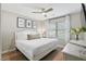 Bedroom featuring a plush bed, botanical prints, and soft natural light from the window at 40 Grand Pavilion Blvd, Isle of Palms, SC 29451